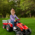 Case ih lil tractor  trailer girl outdoors r facing